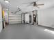 Spacious garage with white walls, shelving, and a ceiling fan at 1701 38Th N St, St Petersburg, FL 33713