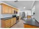 Well-equipped kitchen featuring stainless steel appliances, wooden cabinets, and ample counter space at 1701 38Th N St, St Petersburg, FL 33713