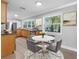 Bright kitchen and dinette featuring stainless steel appliances, wooden cabinets, and a garden view window at 1701 38Th N St, St Petersburg, FL 33713