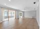 Expansive living room with tile flooring, recessed lighting, and sliding door access at 1701 38Th N St, St Petersburg, FL 33713