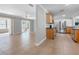 Open-concept living room and kitchen with tile flooring and bright, neutral walls at 1701 38Th N St, St Petersburg, FL 33713