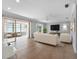 Bright living room with sliding doors to a patio, complemented by neutral furniture and tile floors at 1701 38Th N St, St Petersburg, FL 33713