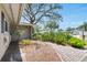 Brick walkway to front door bordered by garden with attractive landscaping at 1739 Woodridge Dr, Clearwater, FL 33756