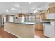 Spacious kitchen offers ample counter space, modern appliances, and open layout for easy entertaining at 1739 Woodridge Dr, Clearwater, FL 33756