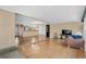 Spacious living area with laminate floors and views into kitchen area and sun room at 1739 Woodridge Dr, Clearwater, FL 33756