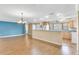 Open-concept living space with plenty of natural light and wood floors connects the kitchen and living areas at 1739 Woodridge Dr, Clearwater, FL 33756