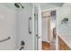 Shower with safety bars and tile surround at 1739 Woodridge Dr, Clearwater, FL 33756