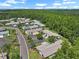 Aerial view of a neighborhood nestled among trees, highlighting the quiet, residential community at 1762 Atrium Dr, Sun City Center, FL 33573