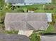 Aerial view of home showing roof, driveway, and landscaping, highlighting the property's layout and curb appeal at 1762 Atrium Dr, Sun City Center, FL 33573