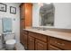 Well-lit bathroom with a granite countertop and ample storage cabinets at 1762 Atrium Dr, Sun City Center, FL 33573