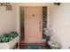 Inviting entryway with a decorated door, tiled floor, and colorful accents at 1762 Atrium Dr, Sun City Center, FL 33573