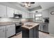 This remodeled kitchen offers stainless appliances and white cabinets at 1762 Atrium Dr, Sun City Center, FL 33573