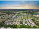 Aerial view of a villa community with mature trees and landscaping at 1802 Bedford Ln # 7, Sun City Center, FL 33573