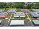 Aerial view of community featuring many identical villas with mature landscaping at 1802 Bedford Ln # 7, Sun City Center, FL 33573