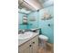 Cozy bathroom with a stylish vanity, toilet, and nautical décor at 1802 Bedford Ln # 7, Sun City Center, FL 33573