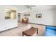 Open-concept dining area with tile flooring, adjacent to the living room at 1802 Bedford Ln # 7, Sun City Center, FL 33573