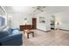 Inviting living room with tile floors and a pass-through to the kitchen at 1802 Bedford Ln # 7, Sun City Center, FL 33573