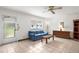 Comfortable living room with tile flooring and access to the outdoors at 1802 Bedford Ln # 7, Sun City Center, FL 33573