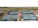 Pickleball courts with shaded seating areas offer a vibrant and social atmosphere for residents to enjoy outdoor activities at 1802 Bedford Ln # 7, Sun City Center, FL 33573