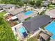 Aerial view showcasing a home with a private backyard pool, perfect for relaxing and entertaining guests at 18516 Snowdonia Dr, Land O Lakes, FL 34638
