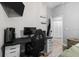 Bright bedroom featuring a workspace area, tv, and comfortable furniture in a spacious layout at 18516 Snowdonia Dr, Land O Lakes, FL 34638