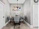 Cozy dining area featuring a round table with seating for four and stylish decor at 18516 Snowdonia Dr, Land O Lakes, FL 34638