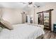 Spacious main bedroom with a bed and a large walk-in closet for ample storage at 18516 Snowdonia Dr, Land O Lakes, FL 34638