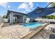 Private backyard pool with basketball hoop, lounge seating and paver patio at 18516 Snowdonia Dr, Land O Lakes, FL 34638