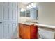 Bathroom featuring a single sink vanity with a granite countertop and wood cabinets at 1877 Pine Cone Cir, Clearwater, FL 33760