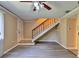 Open living area with new gray floors and staircase to the second floor at 1877 Pine Cone Cir, Clearwater, FL 33760