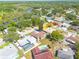Overhead view of a charming neighborhood with river access shows a home that features a private pool and fenced yard at 1913 Libby Ct, Holiday, FL 34690