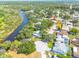 Overhead view of the home with nearby water access and lush greenery in the area at 1913 Libby Ct, Holiday, FL 34690