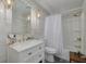 Bright bathroom featuring a white vanity, marble countertop, and modern fixtures at 1913 Libby Ct, Holiday, FL 34690