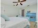 Bedroom features a bed and blue bookshelf at 1913 Libby Ct, Holiday, FL 34690