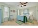 Charming bedroom with a blue bed frame, decorative pillows, and natural light at 1913 Libby Ct, Holiday, FL 34690
