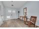 Inviting entryway featuring a rocking chair and warm decor at 1913 Libby Ct, Holiday, FL 34690