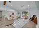 Spacious living room featuring a view to the water, wood floors, and ample seating at 1913 Libby Ct, Holiday, FL 34690