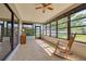Relaxing sunroom with tile floors and natural light from the surrounding large windows at 1913 Libby Ct, Holiday, FL 34690