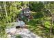 Aerial view of a charming home and detached carport with lush surroundings at 22004 Dupree Dr, Land O Lakes, FL 34639