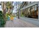 The backyard features a deck with chairs and an exterior of a home featuring large windows at 22004 Dupree Dr, Land O Lakes, FL 34639