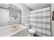 Traditional bathroom featuring a single sink vanity, updated lighting, and neutral-toned tile at 22004 Dupree Dr, Land O Lakes, FL 34639