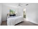 Comfortable bedroom features large window and access to an ensuite bathroom at 22004 Dupree Dr, Land O Lakes, FL 34639