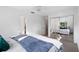 Light bedroom features mirrored closet doors, closet door and carpeted floors at 22004 Dupree Dr, Land O Lakes, FL 34639