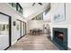An open concept area showcases a dining area with large windows, fireplace, and flows into the kitchen at 22004 Dupree Dr, Land O Lakes, FL 34639