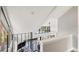 Second floor overlooking the first floor with views of the outside through large windows at 22004 Dupree Dr, Land O Lakes, FL 34639