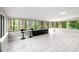 Bright sunroom with floor-to-ceiling windows offering serene outdoor views at 22004 Dupree Dr, Land O Lakes, FL 34639