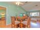 Open-concept dining area featuring a round wooden table and chairs, perfect for entertaining or Gathering meals at 2285 Hidden Meadows E Dr, Palm Harbor, FL 34683