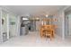 Open floor plan showcases the kitchen flowing into a dining area with patio access at 2285 Hidden Meadows E Dr, Palm Harbor, FL 34683