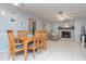 Comfortable dining room seamlessly connected to the living room and fireplace at 2285 Hidden Meadows E Dr, Palm Harbor, FL 34683
