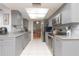 Modern kitchen featuring stainless steel appliances and ample countertop space at 2285 Hidden Meadows E Dr, Palm Harbor, FL 34683